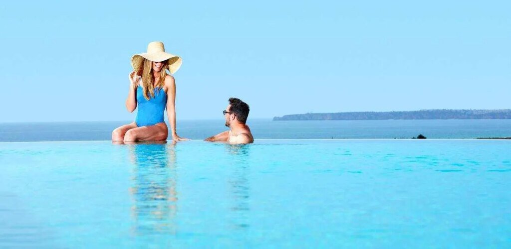 Longevity-Health-Wellness-Hotel-couple-in-infinity-pool.jpg