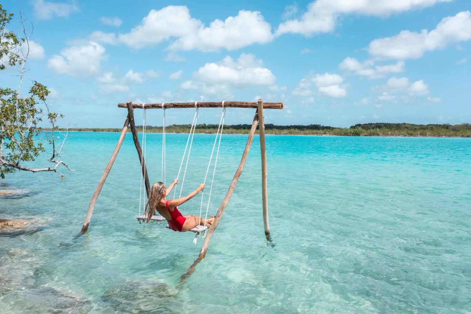 Woman-swinging-on-white-sand-beach-in-Mexico-Mystockimages-iStock_259725d923.jpg